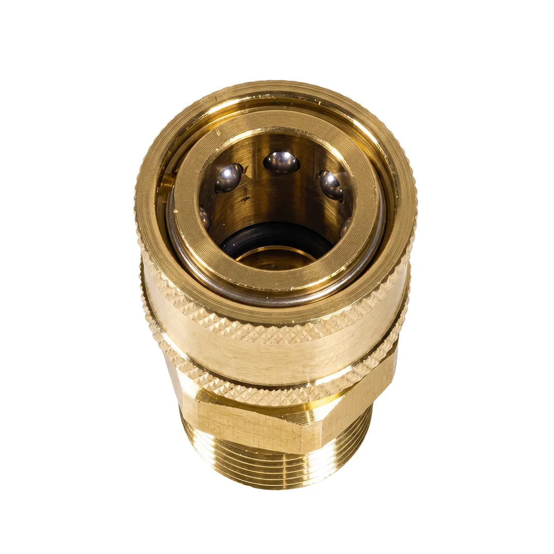 Top-down close-up of brass pressure washer adapter showing 3/8 inch female quick connect opening and locking balls